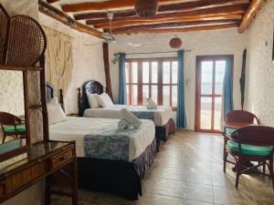 Postel nebo postele na pokoji v ubytování Golden Paradise Beachfront