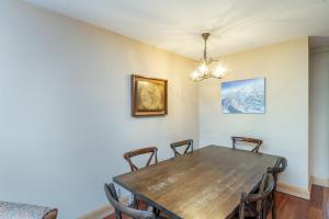 a dining room with a wooden table and chairs at Cimarron Lodge 35 condo in Telluride