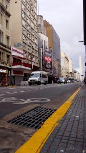 a city street with cars driving down the street at Mía Apart in Buenos Aires