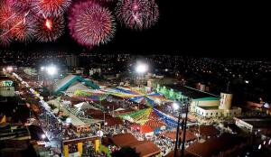 a festival with fireworks exploding in the sky over a city at Loft Vava in Campina Grande
