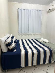 Postel nebo postele na pokoji v ubytování Rocha's Apartment Eunápolis