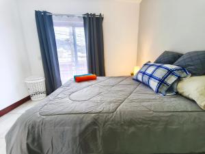 Giường trong phòng chung tại Apto Moderno #5 Casa Tía Tona Zona 1