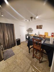 a kitchen with a table and chairs in a room at WHOLE HOME Cheerful Quiet 2 bedroom home 20 minutes from beaches in North Lauderdale +13 photos