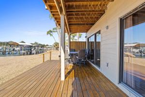 a wooden deck with a view of the beach at Waterfront Escape 3BR Townhome Pet-Friendly Sleeps 8 in Marietta +56 photos