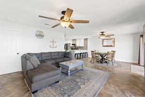 a living room with a couch and a ceiling fan at Waterfront Escape 3BR Townhome Pet-Friendly Sleeps 8 in Marietta