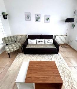 a living room with a couch and a coffee table at Departamentos Echeverria in Río Gallegos