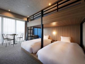 ES CON FIELD HOKKAIDO HOTEL Kitahiroshima Station客房内的一张或多张床位
