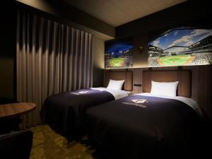 ES CON FIELD HOKKAIDO HOTEL Kitahiroshima Station客房内的一张或多张床位