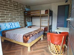 Postel nebo postele na pokoji v ubytování cabañas Ticomulco + 4 fotografie