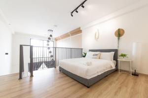 a bedroom with a bed in a room at Emporis Kota Damansara PJ by Sleepy Bear in Petaling Jaya