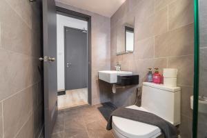 a bathroom with a toilet and a sink at Emporis Kota Damansara PJ by Sleepy Bear in Petaling Jaya +34 photos