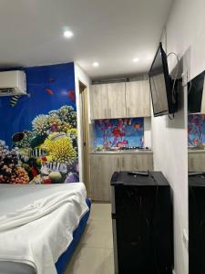 TV a/nebo společenská místnost v ubytování tocore suites beach