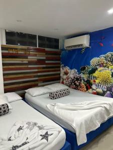 Postel nebo postele na pokoji v ubytování tocore suites beach