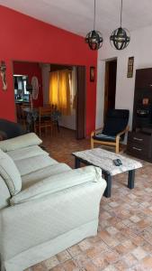 a living room with a couch and a coffee table at Casa a 800 mts de pleno centro in Villa Carlos Paz