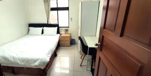 Postel nebo postele na pokoji v ubytování 大新民宿Da Xin Homestay