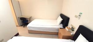 Postel nebo postele na pokoji v ubytování 大新民宿Da Xin Homestay