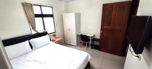 Postel nebo postele na pokoji v ubytování 大新民宿Da Xin Homestay