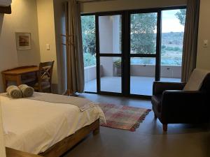 Ένα ή περισσότερα κρεβάτια σε δωμάτιο στο Imberbe Private Lodge