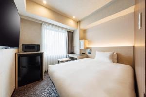 Postel nebo postele na pokoji v ubytování JR-East Hotel Mets Shibuya + 37 fotografií