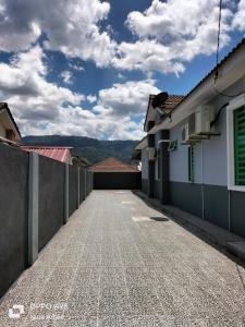 an empty street in the middle of a building at Ñídä Âdlèë Hômèstày Sïk Kédãh in Kampong Sungai Terap