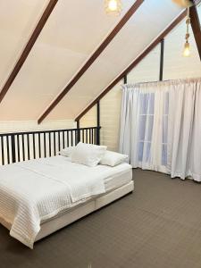 Katil atau katil-katil dalam bilik di Tok Abah Cottage