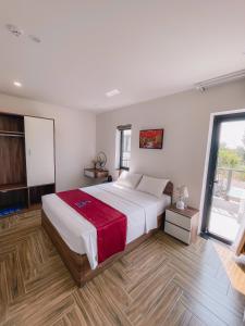 Ένα ή περισσότερα κρεβάτια σε δωμάτιο στο Blue Sea Hotel