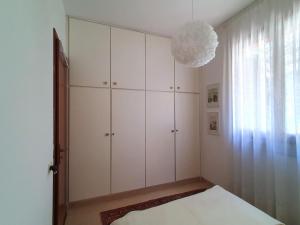 A bed or beds in a room at Belvilla by OYO PAN03 3 - Residenza Panorama