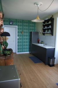 a kitchen with a sink and a counter top at Charming Gite In Mont Saint Vincent in Mont-Saint-Vincent