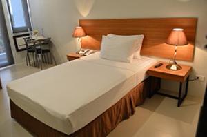 Postel nebo postele na pokoji v ubytování Mango Suites - Isabela