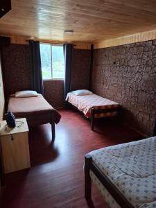 Postel nebo postele na pokoji v ubytování Departamentos Espacio Rio Chovellen + 1 fotografie