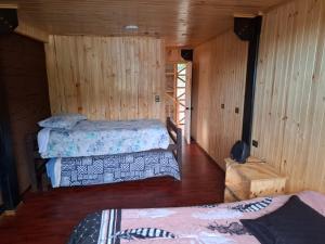 Postel nebo postele na pokoji v ubytování Departamentos Espacio Rio Chovellen