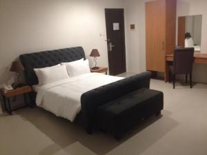 Postel nebo postele na pokoji v ubytování Mango Suites - Isabela