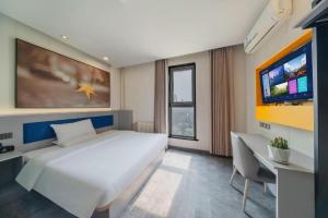 Μια τηλεόραση ή/και κέντρο ψυχαγωγίας στο 7 Days Inn Tai'an Dongpingxi Hualian