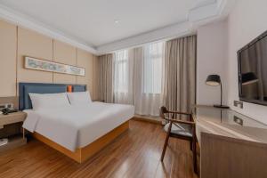 Ένα ή περισσότερα κρεβάτια σε δωμάτιο στο Yitel Shanghai Hongqiao Railway Station National Convention and Exhibition Center +252 φωτογραφίες