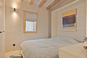 Rúm í herbergi á Penthouse with Rooftop apartment in the Barceloneta - Barcelona