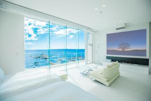 Una cama o camas en una habitación de ビーチテラス房総