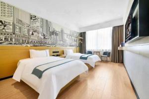 Postel nebo postele na pokoji v ubytování City Comfort Inn Wuhan Xinzhou Mo'er Cheng + 197 fotografií