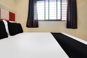 Postel nebo postele na pokoji v ubytování Hotel Orange Residency