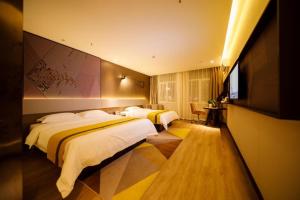Postel nebo postele na pokoji v ubytování IU Hotels· Xincheng Haibing University Store + 270 fotografií