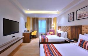 Voodi või voodid majutusasutuse Hotel Sun Plaza By Unit Of IVY toas