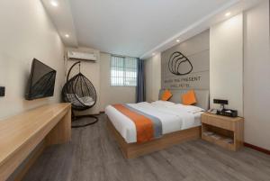 TV a/nebo společenská místnost v ubytování Shell Hotel Suzhou Zhangjiagang Jingang Town Central Plaza