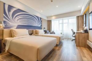 Postel nebo postele na pokoji v ubytování Atour Hotel Changsha Wuyi Square Wanbao Avenue + 126 fotografií