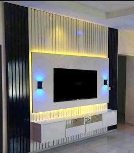 TV a/nebo společenská místnost v ubytování Afrodev experience