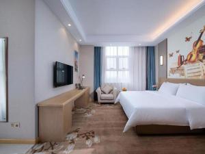 Postel nebo postele na pokoji v ubytování Vienna Hotel Jinan Railway Station + 90 fotografií