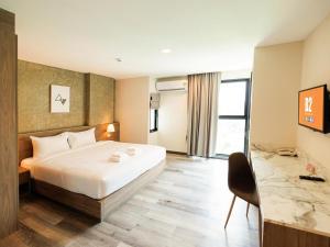 Postel nebo postele na pokoji v ubytování B2 Khon Kaen Premier Hotel + 79 fotografií