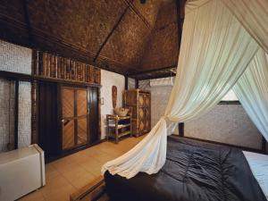 A bed or beds in a room at Sasak Experience