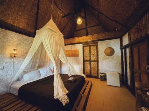 A bed or beds in a room at Sasak Experience