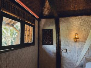 A bed or beds in a room at Sasak Experience
