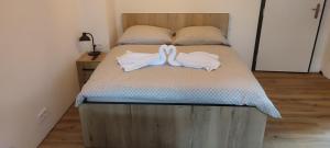 Postel nebo postele na pokoji v ubytování Apartmán Orchidea 3