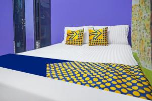 Hotel O Kost Qiu Qiu 99にあるベッド